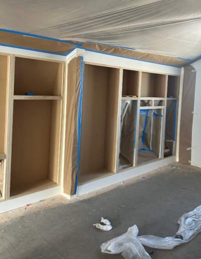 Worn and faded cabinets with chipped paint and outdated appearance before painting
