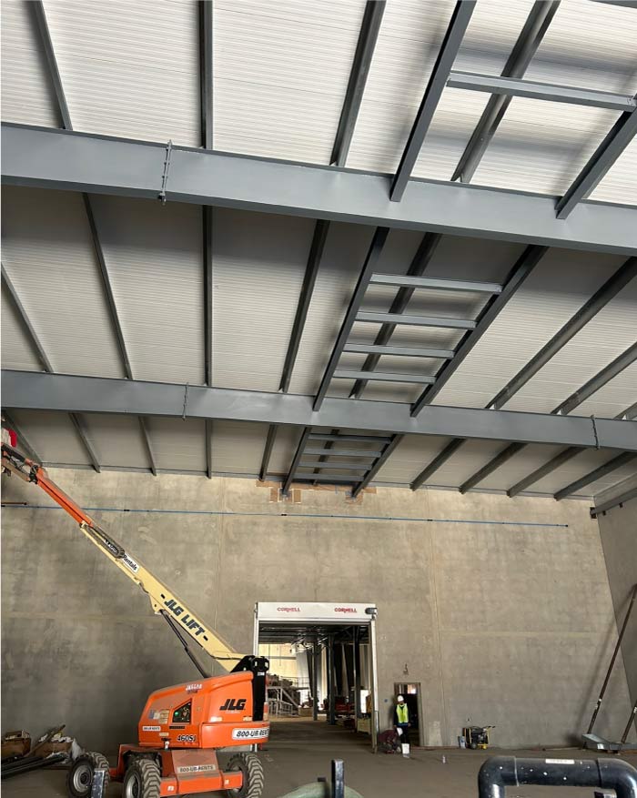 Durable and washable paint being applied to a commercial roof in visalia ca