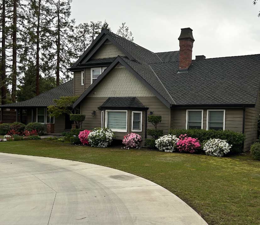 painters in fowler, ca meticulously transforming a home's exterior, ensuring a flawless finish.