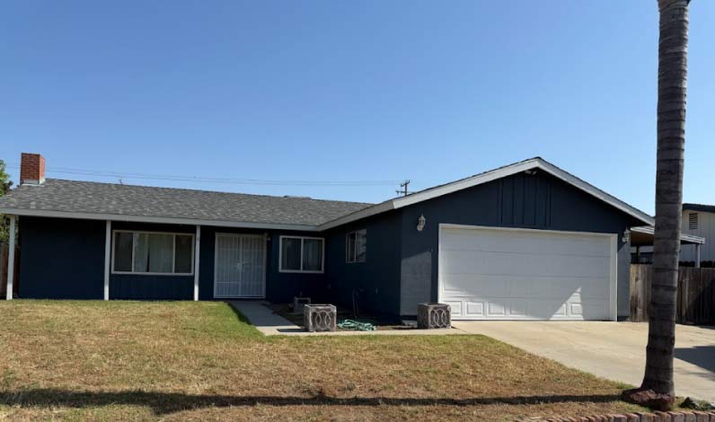 Adding a fresh, protective coat to a residential exterior house in Visalia, extending outdoor living enjoyment.