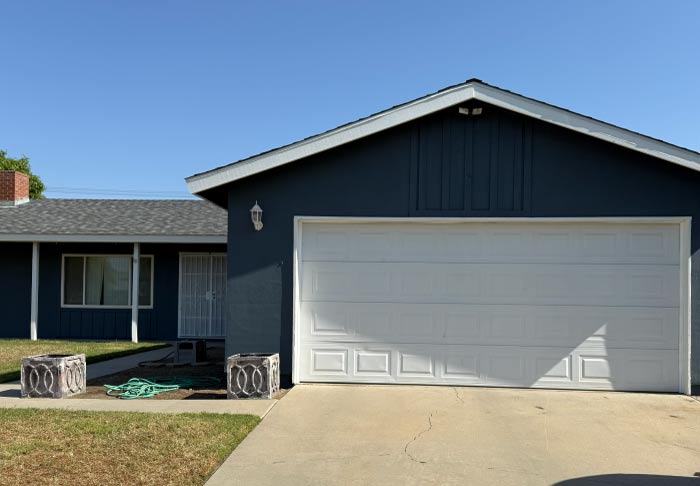 Residential exterior painting in lindsay, ca enhancing curb appeal with fresh, vibrant colors.